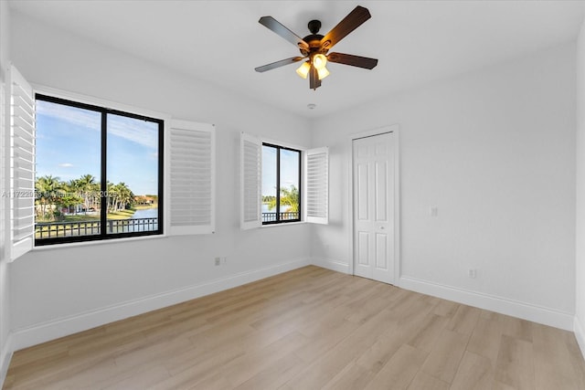 unfurnished room with light hardwood / wood-style floors and ceiling fan