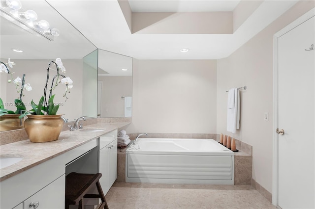 bathroom with vanity and a bathing tub