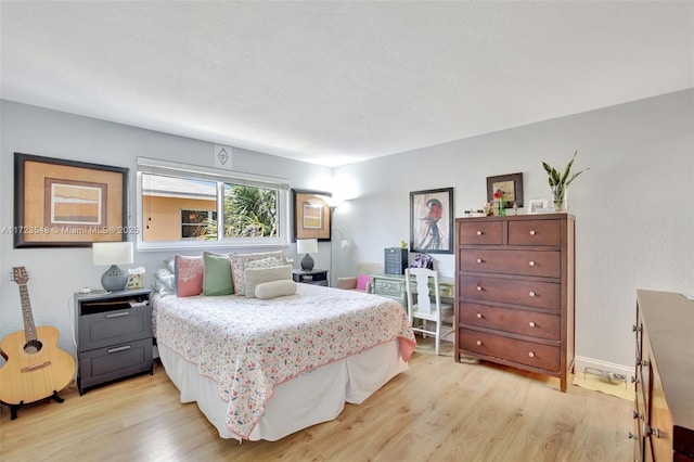 bedroom with light wood-type flooring