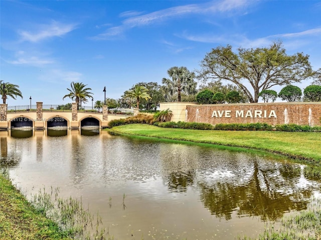 community sign with a water view