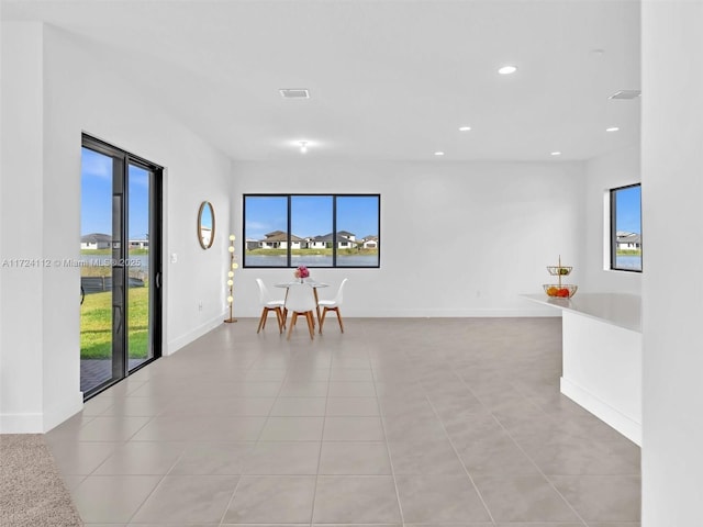 unfurnished room featuring light tile patterned floors