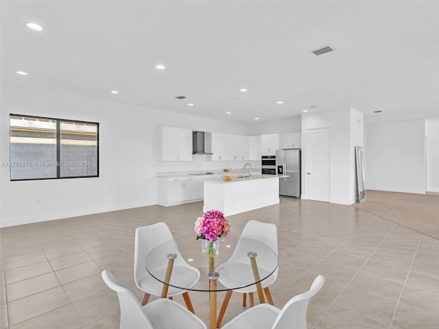 tiled dining area featuring sink