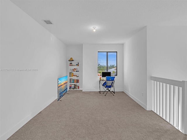 recreation room with light carpet