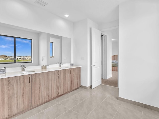 bathroom with vanity and tile patterned floors