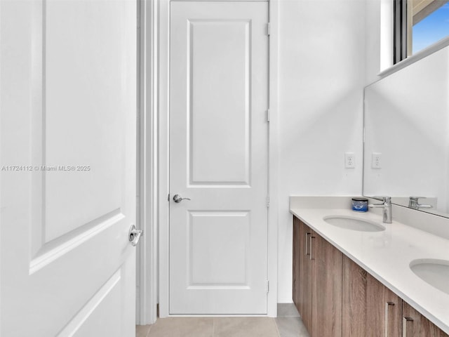 bathroom with vanity and tile patterned floors