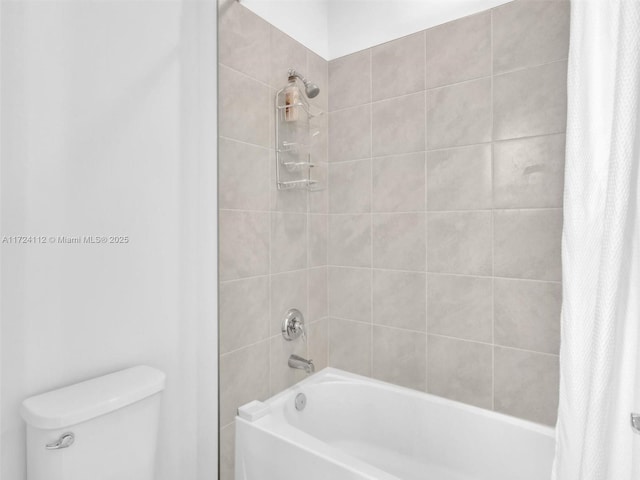 bathroom with toilet and shower / tub combo with curtain