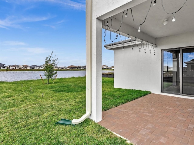 view of patio featuring a water view