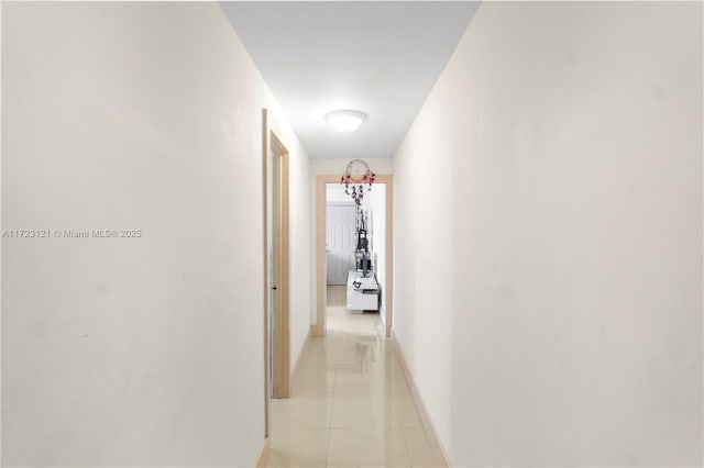 hallway featuring light tile patterned floors