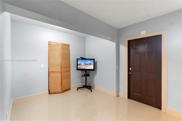 foyer featuring tile patterned floors