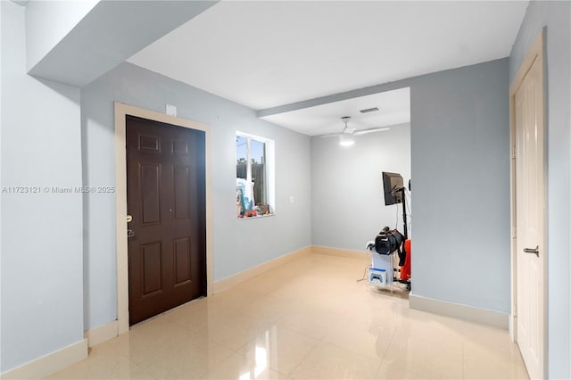 entrance foyer featuring ceiling fan