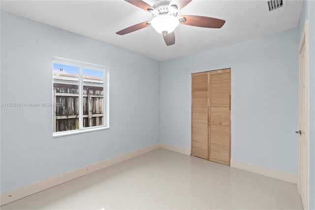 unfurnished bedroom featuring a closet and ceiling fan