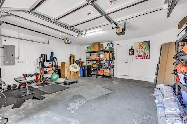 garage featuring electric panel and a garage door opener