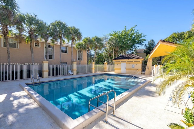 view of swimming pool with a patio