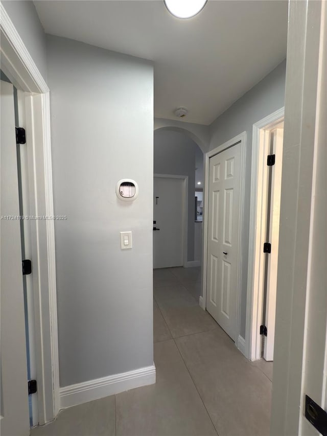 hallway with light tile patterned floors