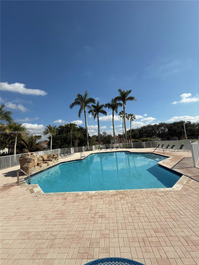 view of swimming pool with a patio area