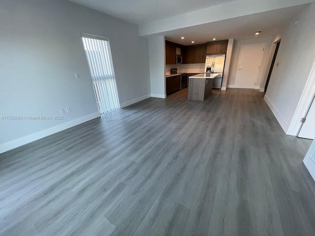 unfurnished living room featuring hardwood / wood-style floors