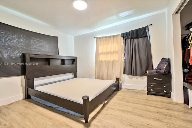 bedroom featuring wood finished floors