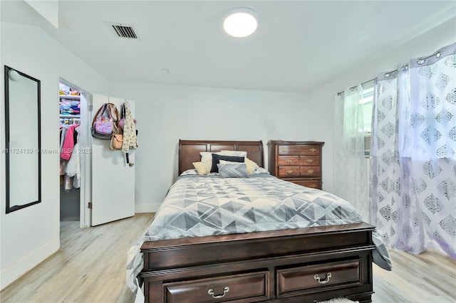 bedroom with light hardwood / wood-style floors