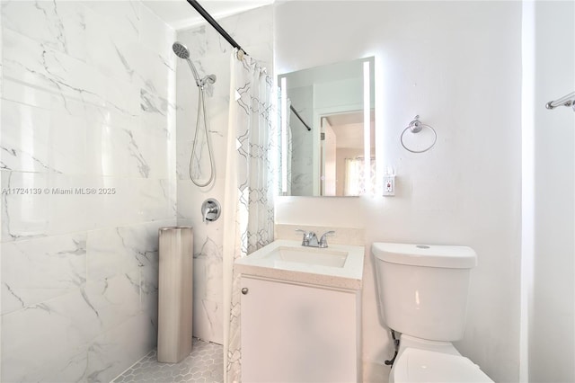 bathroom featuring vanity, curtained shower, and toilet