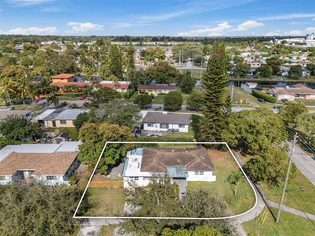 birds eye view of property with a residential view and a water view