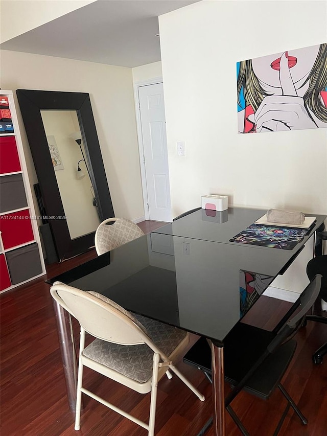 dining area featuring dark hardwood / wood-style floors