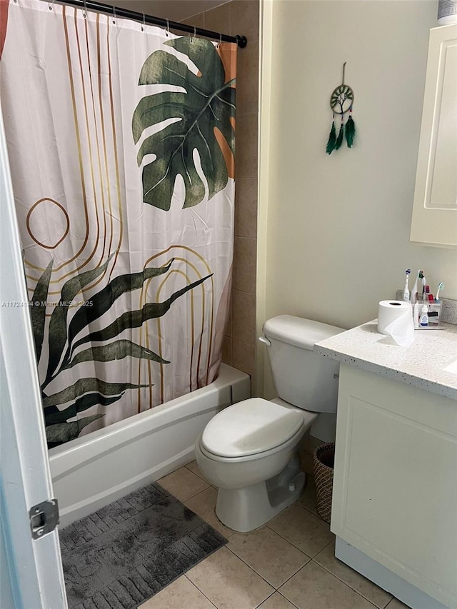 full bathroom with toilet, vanity, tile patterned floors, and shower / bath combination with curtain