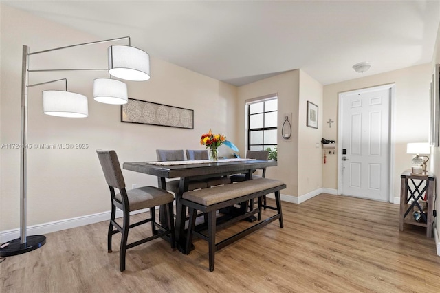 dining space featuring light hardwood / wood-style flooring