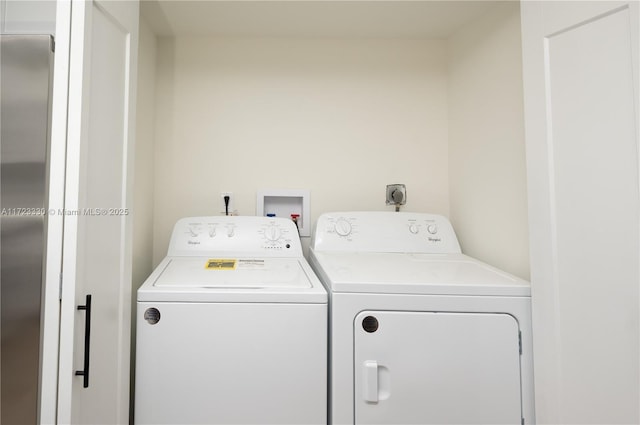 washroom featuring independent washer and dryer