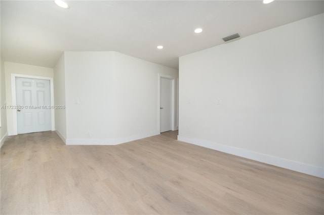 unfurnished room featuring light hardwood / wood-style flooring