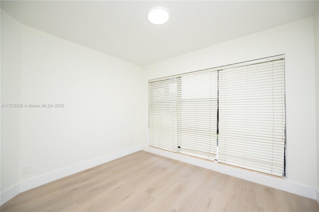 unfurnished room featuring light wood-type flooring