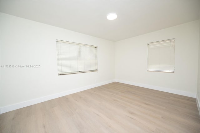 unfurnished room featuring light hardwood / wood-style floors