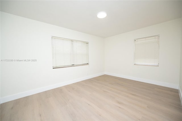 unfurnished room featuring light wood-type flooring