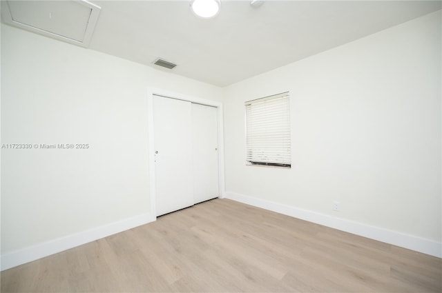 unfurnished room featuring light wood-type flooring