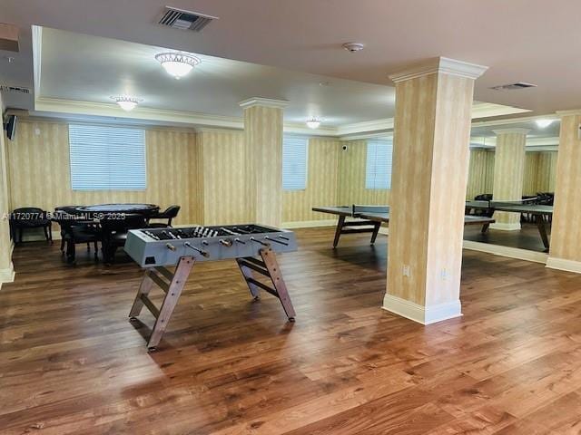 playroom with hardwood / wood-style flooring, ornamental molding, and ornate columns