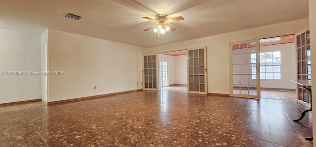 empty room featuring ceiling fan