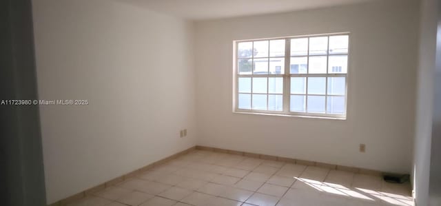 view of tiled spare room