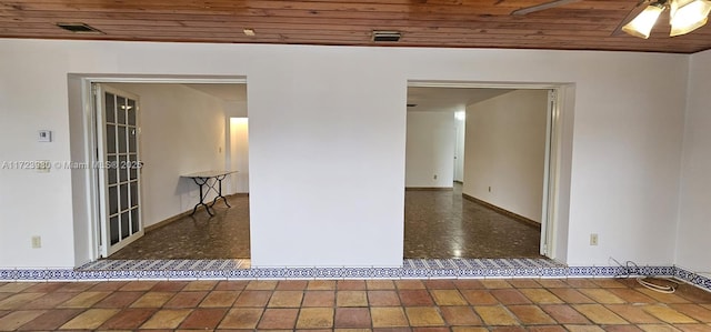 spare room with wood ceiling