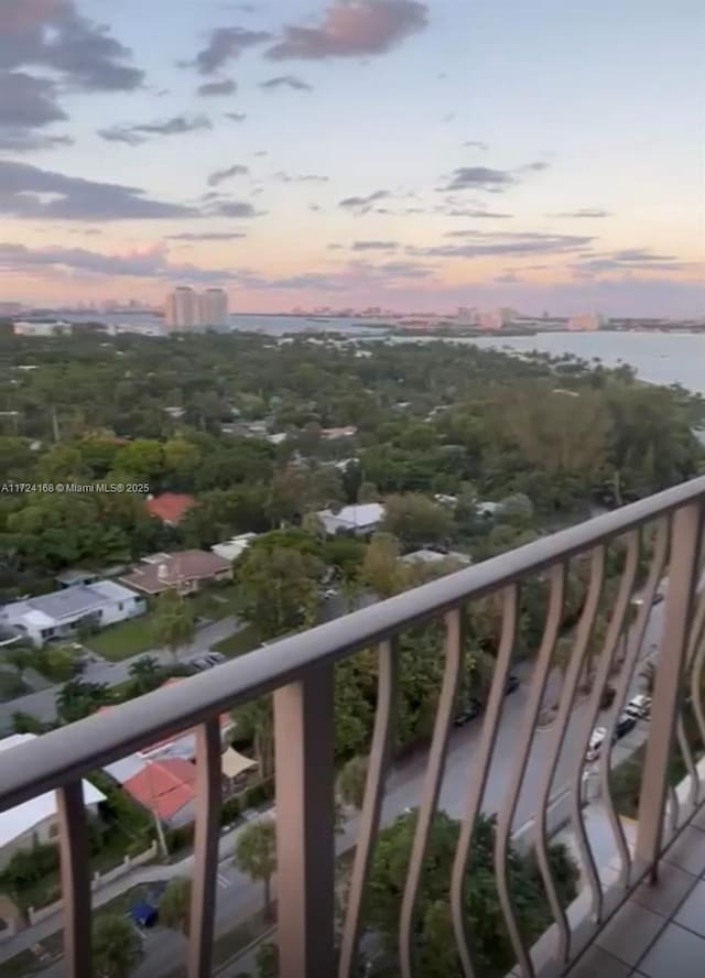 balcony at dusk with a water view