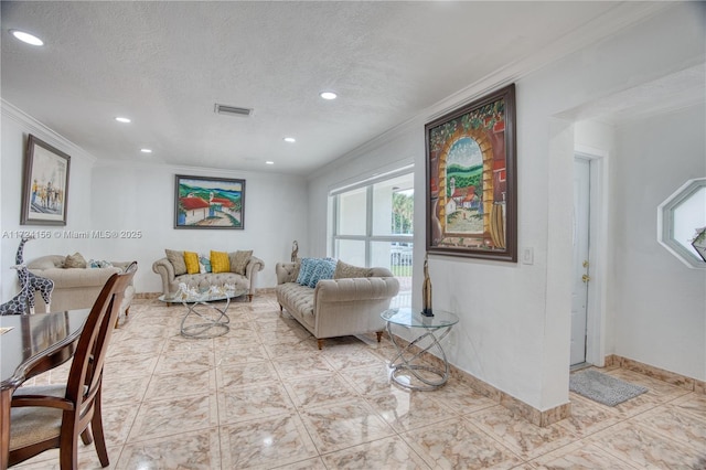 tiled living room with a textured ceiling and ornamental molding