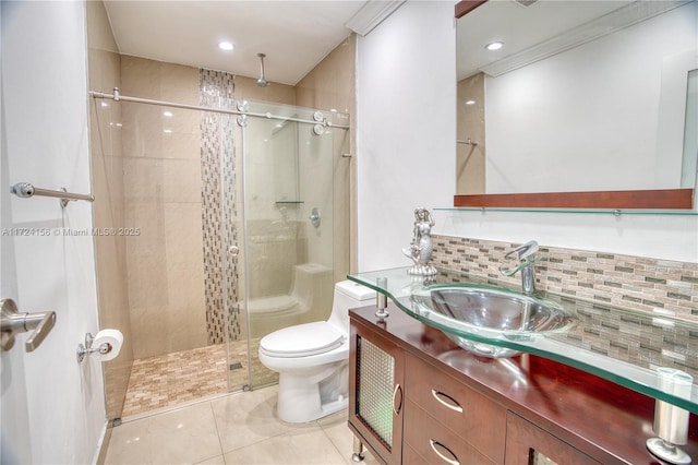 bathroom with decorative backsplash, toilet, an enclosed shower, and vanity