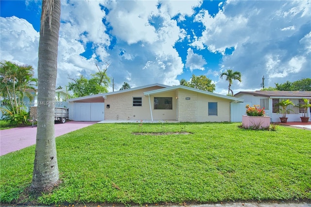 ranch-style house with a carport and a front yard