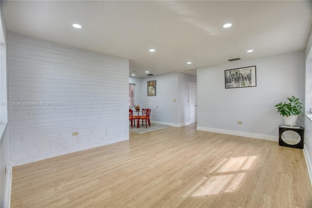 unfurnished living room featuring light wood-type flooring