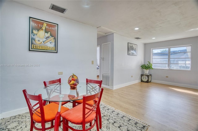 dining area with light hardwood / wood-style flooring