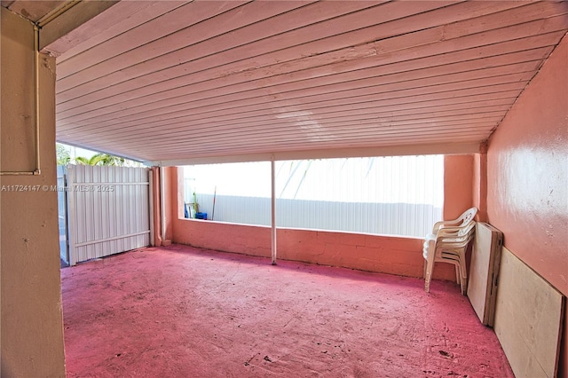 unfurnished sunroom featuring wood ceiling