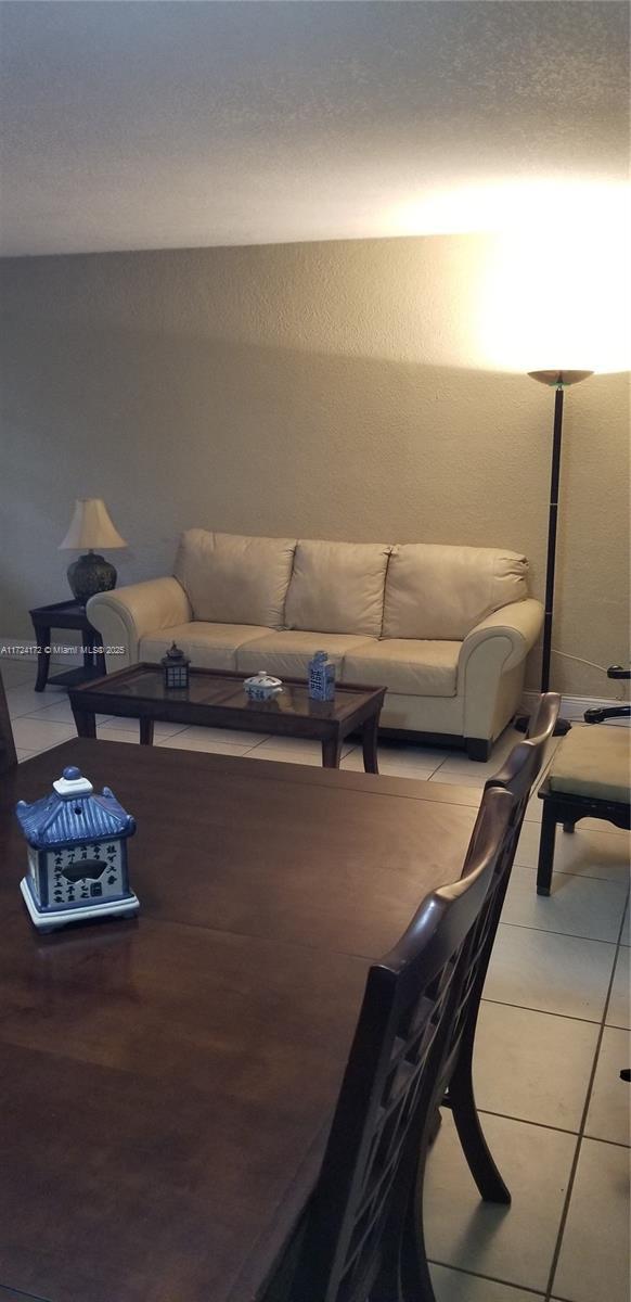 living room featuring tile patterned flooring