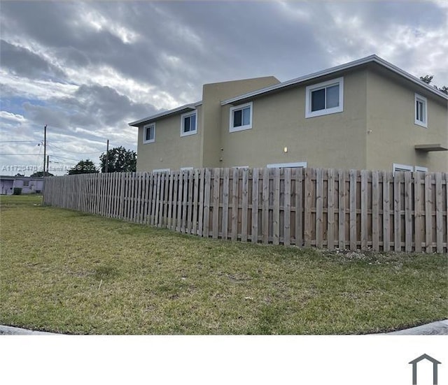 view of home's exterior with a lawn