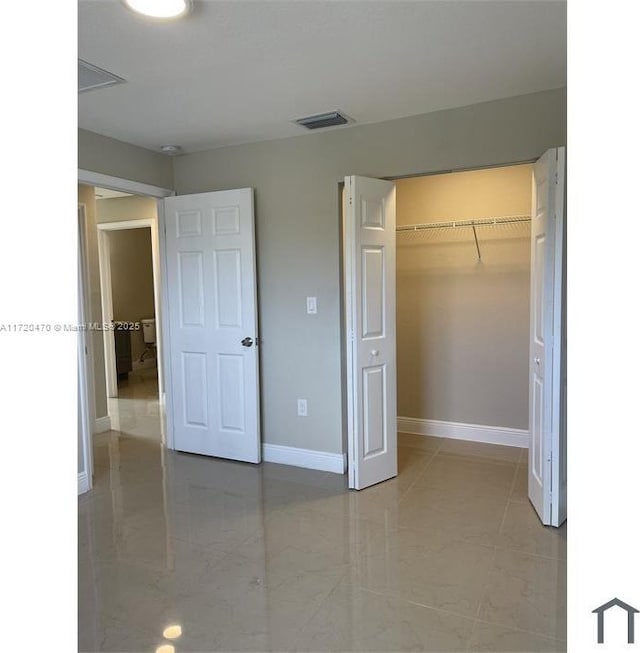 unfurnished bedroom featuring a closet