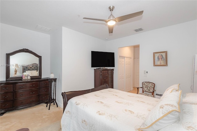 bedroom with light carpet, a closet, and ceiling fan