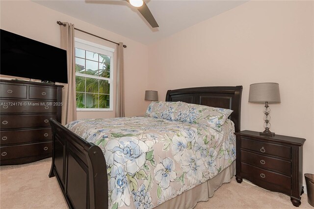 bedroom with ceiling fan and light colored carpet