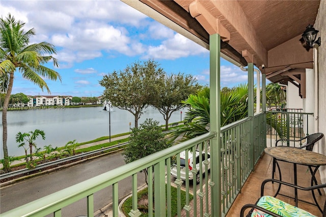 balcony featuring a water view